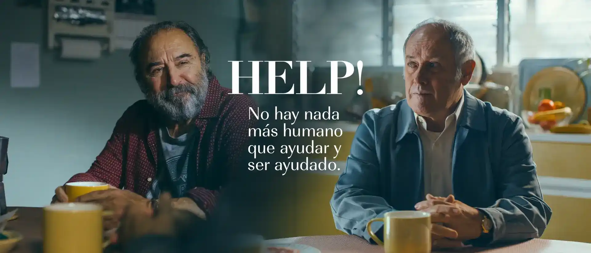 Imagen de la campaña HELP! No hay nada más humano que ayudar y ser ayudado de Santalucía, con dos personas conversando en una cocina